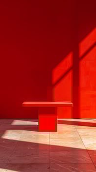 A hardwood red bench rests in front of a magenta wall photo