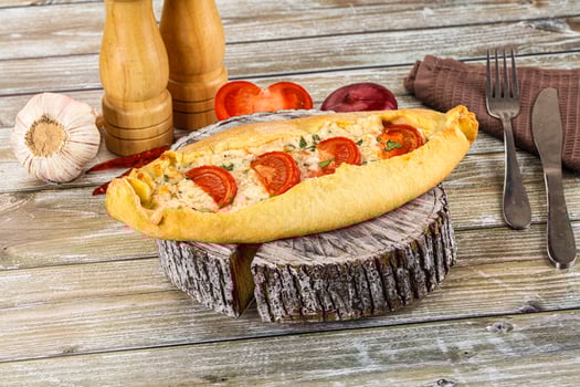 Turkish Pide with cheese and tomato photo