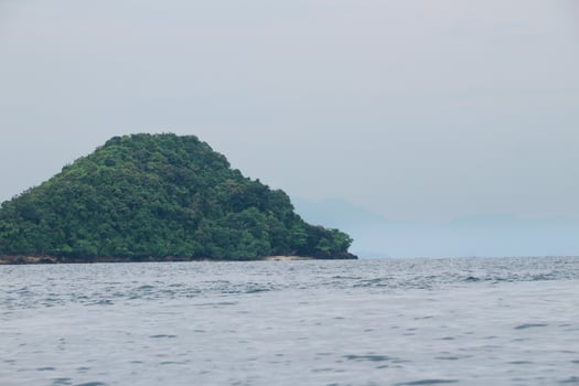 beautiful view of the tropical beach of Pahawang Island, Lampung. Landscape in the highland natural park. Panoramic view by the sea. photo