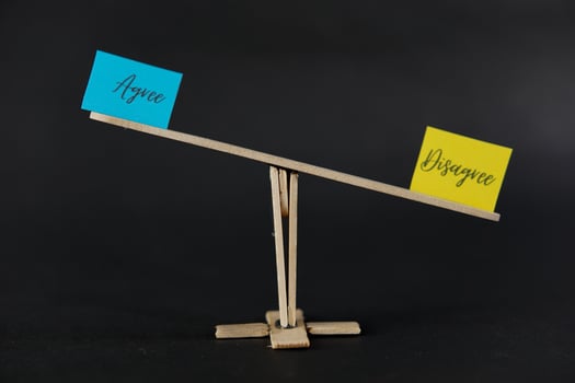 concept of duality using sticky notes with the antonym words Agree - Disagree made by hand on a dark background photo