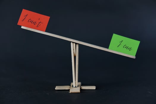 concept of duality using sticky notes with the motivational words I can't - I can made by hand on a dark background photo