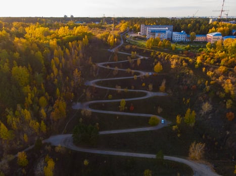 Aerial top vew of winding road in the city photo