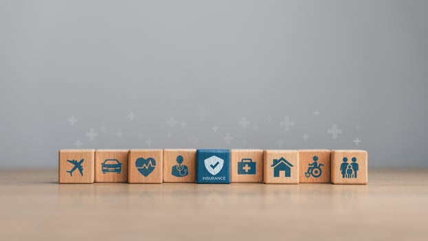 Health insurance and assurance concept. Healthcare, Medical services, health insurance benefits, medical expenses, life, car, home, accident and travel insurance. Wooden blocks with insurance icons photo