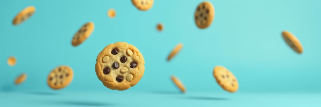 Cookies floating in mid-air against a vibrant blue background create a playful and eye-catching visual display photo