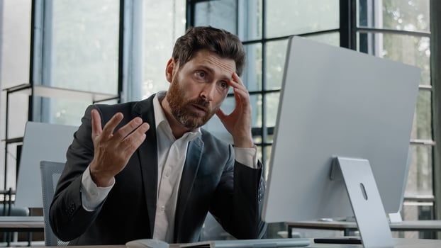 Caucasian 40s bearded boss investor entrepreneur employer man in office with computer working typing has problem with online project incorrect data in service lost connection bad result upset failure photo