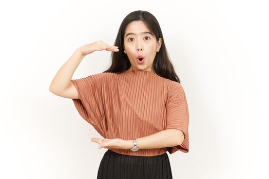 Measuring and Showing Big Sign Product Of Beautiful Asian Woman Isolated On White Background photo