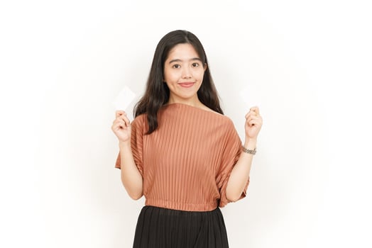 Showing Blank Credit or Bank Card Of Beautiful Asian Woman Isolated On White Background photo