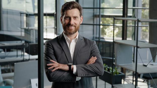 Caucasian 40s middle-aged adult bearded successful boss investor entrepreneur employer business man leader lawyer in office posing confident strong pose position with crossed folded hands arms smiling photo