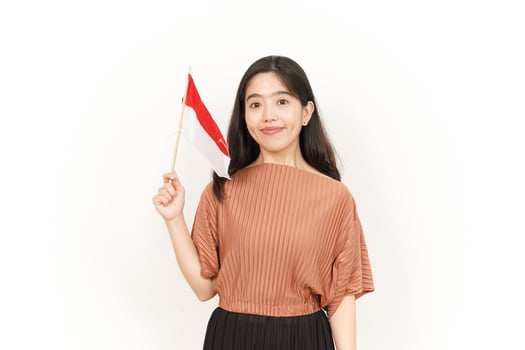 Holding Indonesian Flag Of Beautiful Asian Woman Isolated On White Background photo