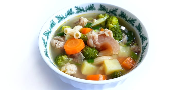 Sayur sop or vegetable with meat soup on the plate. Indonesian popular culinary. Healthy food and delicious photo