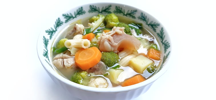 Sayur sop or vegetable with meat soup on the plate. Indonesian popular culinary. Healthy food and delicious photo