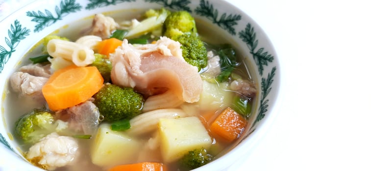Sayur sop or vegetable with meat soup on the plate. Indonesian popular culinary. Healthy food and delicious photo