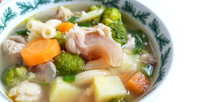 Sayur sop or vegetable with meat soup on the plate. Indonesian popular culinary. Healthy food and delicious photo