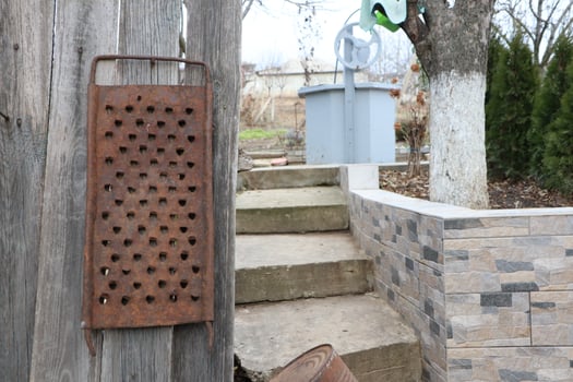 Explore the charm of a Rustic Grater and Stone Steps in a lovely Outdoor Setting photo