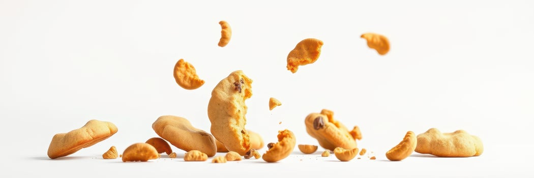 Crumbled cookies scattered on a clean white surface during a baking session around midday photo