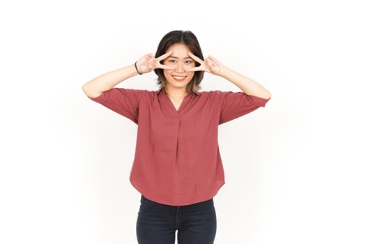 Showing Peace Sign Of Beautiful Asian Woman Isolated On White Background photo