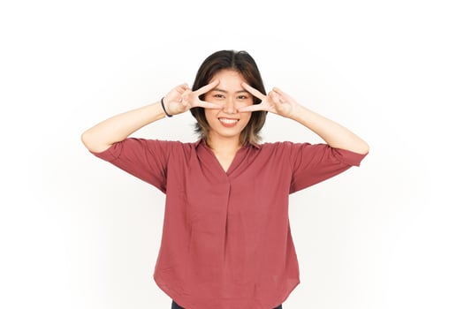 Showing Peace Sign Of Beautiful Asian Woman Isolated On White Background photo