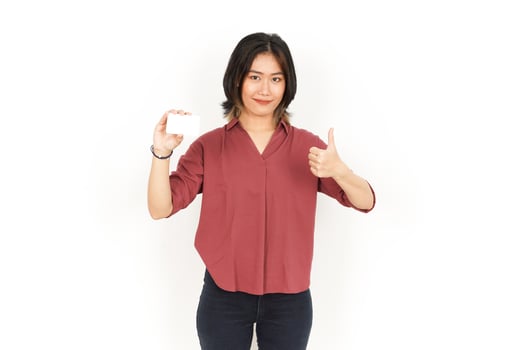 Showing Blank Credit or Bank Card Of Beautiful Asian Woman Isolated On White Background photo