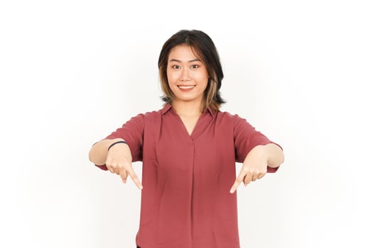 Presenting and Pointing down Product Of Beautiful Asian Woman Isolated On White Background photo