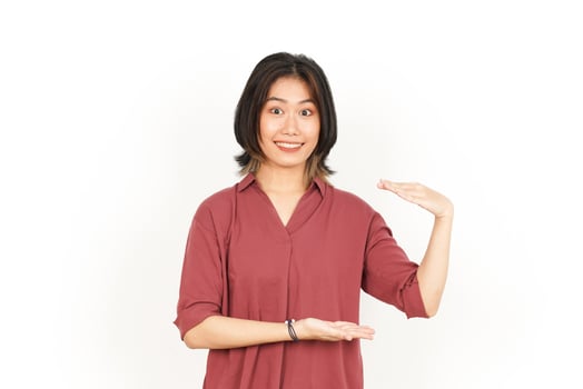Measuring and Showing Big Sign Product Of Beautiful Asian Woman Isolated On White Background photo