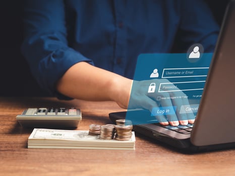Businessman using a laptop login to the network system on a virtual screen photo