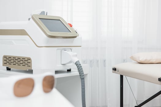 Room in spa center with laser epilation equipment photo