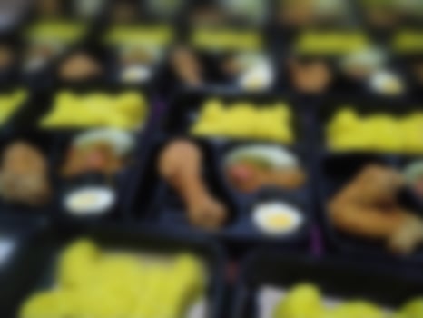 Blurred background Traditional Indonesian Yellow Rice Bento photo