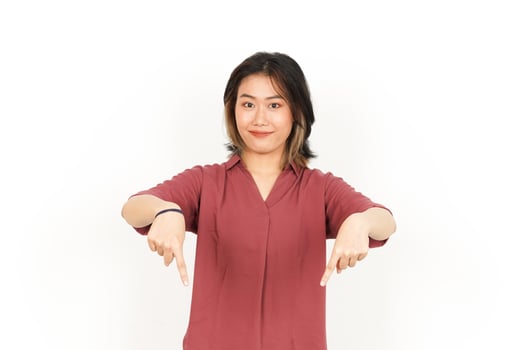 Showing Product and Pointing Down Of Beautiful Asian Woman Isolated On White Background photo