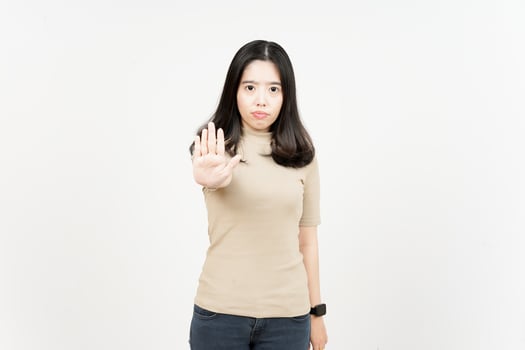 Rejection Hand Gesture Of Beautiful Asian Woman Isolated On White Background photo