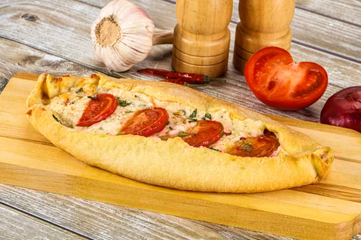 Turkish Pide with cheese and tomato photo