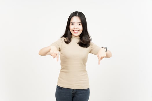 Pointing down and showing blank copy space Of Beautiful Asian Woman Isolated On White Background photo