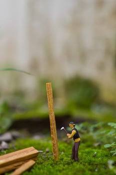 A diorama is a three-dimensional miniature depicting a particular scene or scene. A diorama depicting someone cutting wood. photo