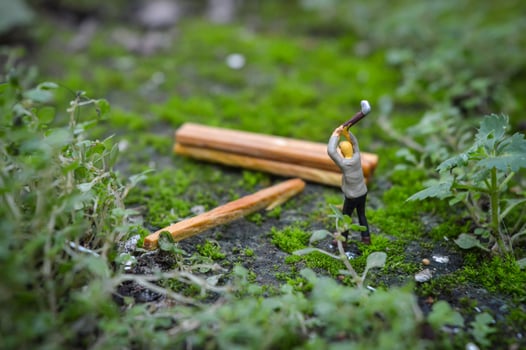 A diorama is a three-dimensional miniature depicting a particular scene or scene. A diorama depicting someone cutting wood. photo