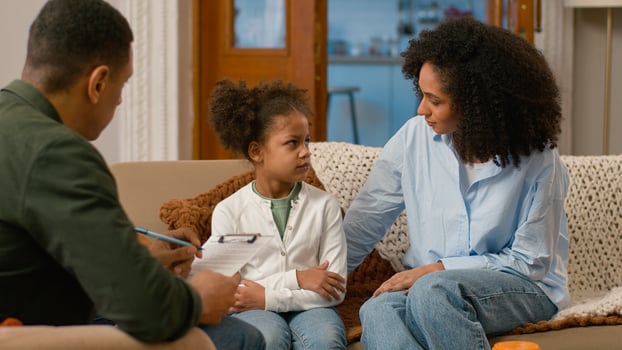 African American mother daughter together visit psychologist social worker bad relationship adolescence child little girl arms crossed get up leave problems quarrel conflict misunderstanding ignorance photo