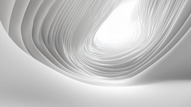 White spiral with a white light shining on it. The spiral is made of paper and is very thin photo