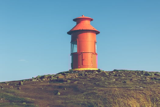 Red Lighthouse on a hill, Iceland photo