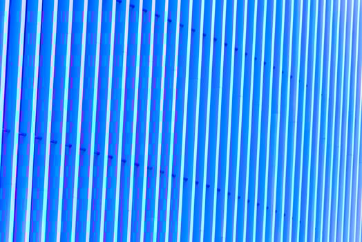 Detail of blue striped metal facade for background photo