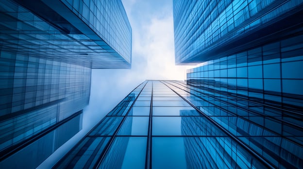 City skyline with tall buildings and a clear blue sky. The buildings are made of glass and are very tall photo