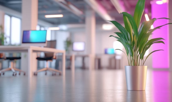 A plant in a metal pot on a table in an office photo