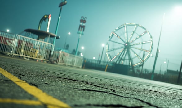 A ferris wheel is seen in the distance at night photo