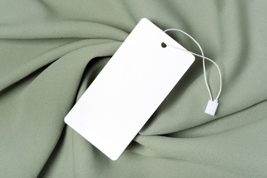 White clothing tag label blank mockup template with the ribbon, to place your design photo