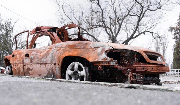 Burnt damaged car of a civilian during the war. Russians against the Ukrainian people, genocide photo