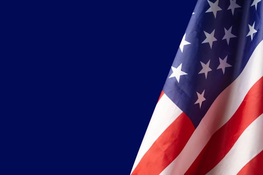 The American flag is on a blue background photo