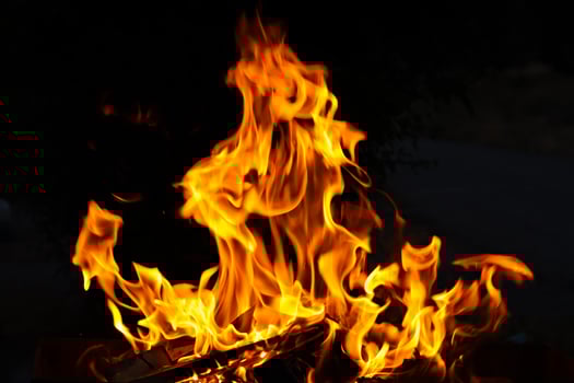 Close up of fire flames in barbecue photo