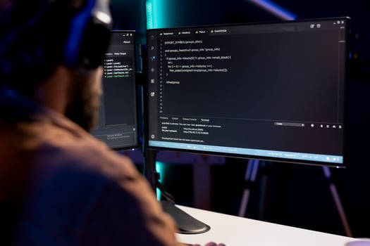 Programmer writing code on computer to futureproof company network from downtimes and unexpected system failures. Man deploying programming script increasing data security photo