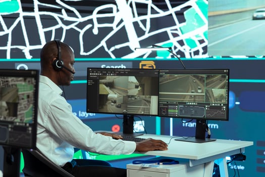 African american call center operator updating clients on possible order delays due to heavy traffic in the city, monitoring couriers to ship cargo faster. Employee provides order tracking service. photo