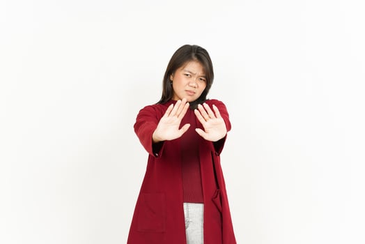 Rejection Gesture Of Beautiful Asian Woman Wearing Red Shirt Isolated On White Background photo