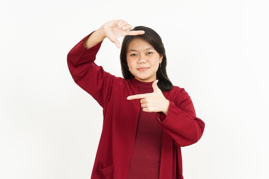 Making frame with hands Of Beautiful Asian Woman Wearing Red Shirt Isolated On White Background photo