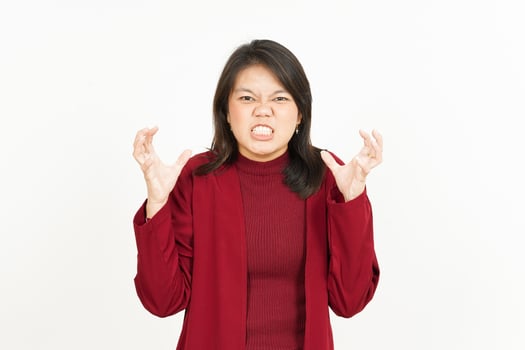 Angry Gesture Of Beautiful Asian Woman Wearing Red Shirt Isolated On White Background photo