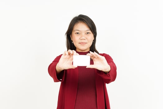 Holding and Showing Blank Credit or Bank Card Of Beautiful Asian Woman Wearing Red Shirt photo